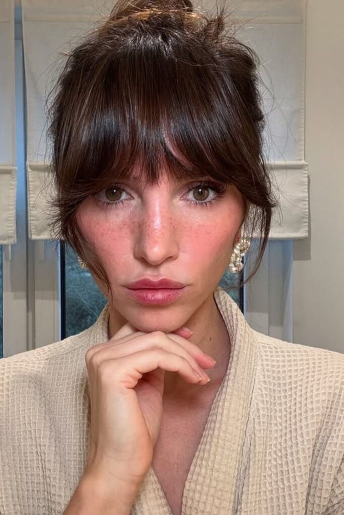 Tousled Updo with Bangs.
